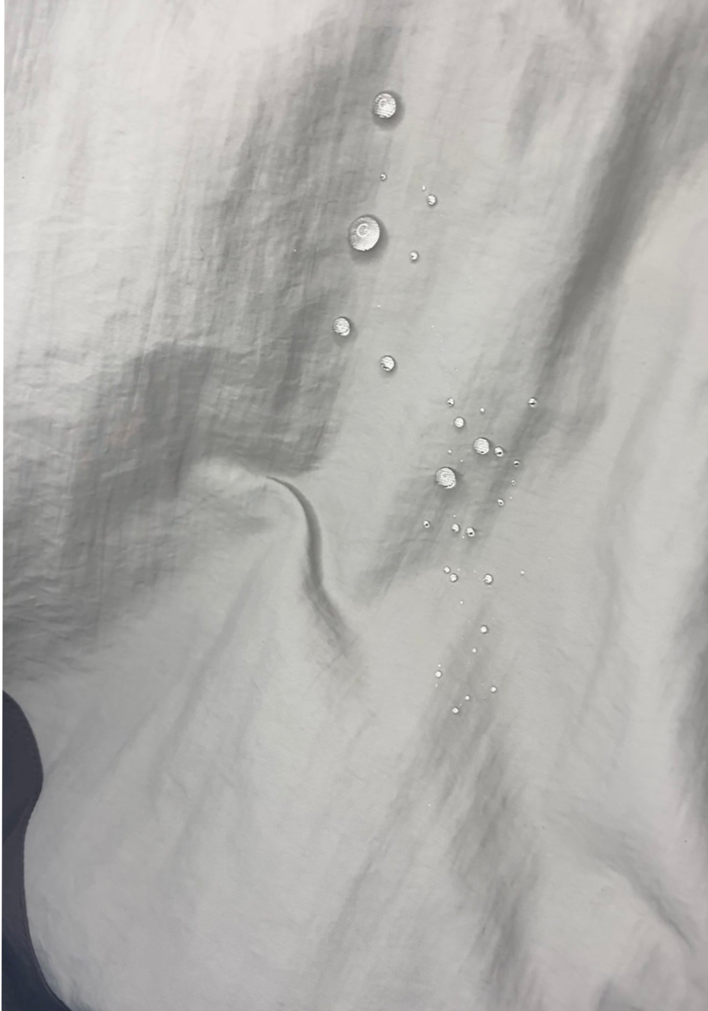 polyester fabric with water droplets over it